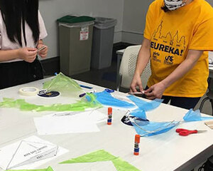 students creating indoor kites