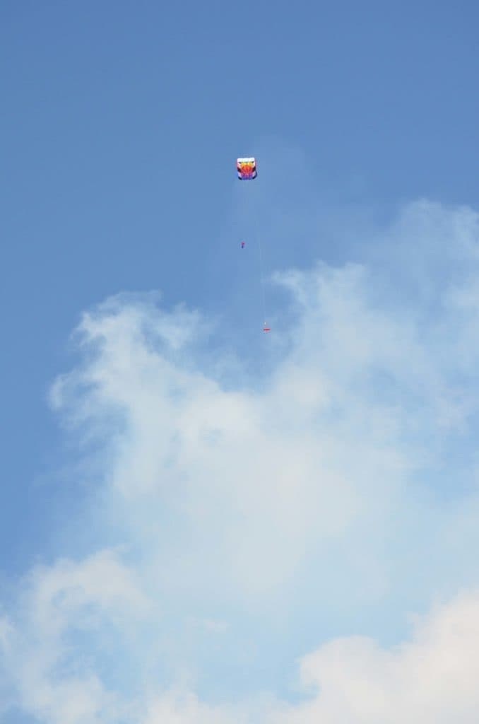 Aeropod flying under parafoil 10 kite with volcanic haze in the foreground